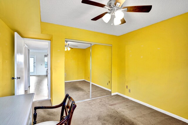475 Piedmont J, Delray Beach, FL 33484 - unfurnished office featuring baseboards, carpet, a textured ceiling, and a ceiling fan