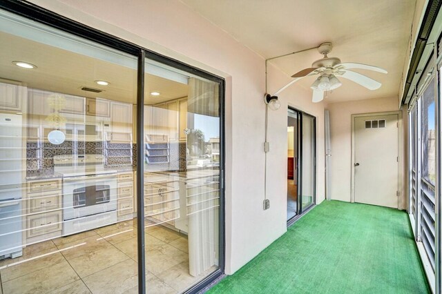 475 Piedmont J, Delray Beach, FL 33484 - unfurnished sunroom featuring visible vents and a ceiling fan