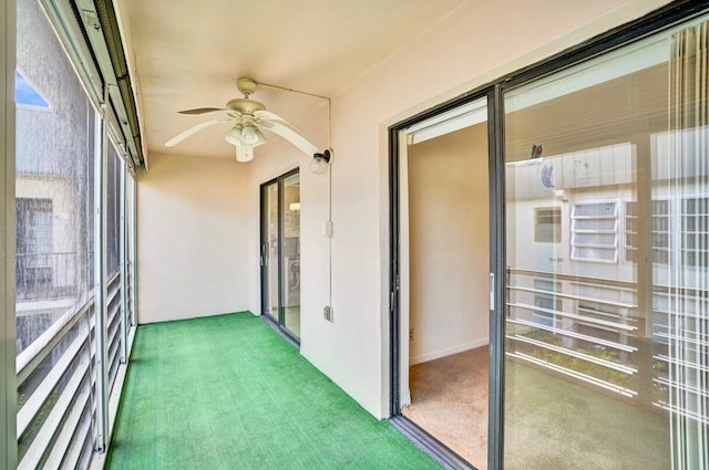 475 Piedmont J, Delray Beach, FL 33484 - unfurnished sunroom with a ceiling fan and carpet floors