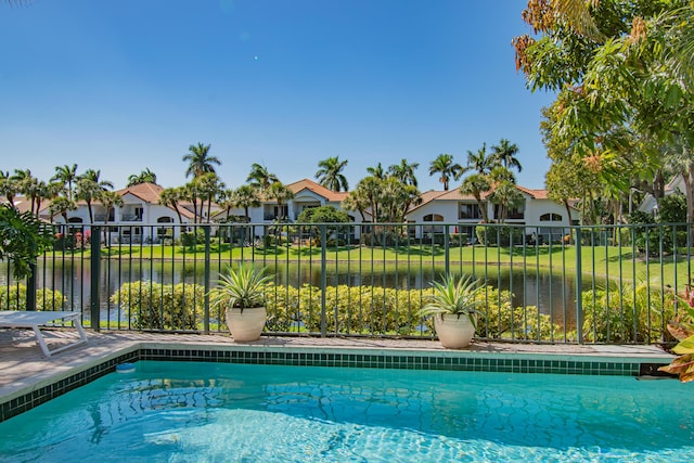 2221 NW 62nd Dr, Boca Raton, FL 33496 - view of swimming pool with a water view, fence, a residential view, and a fenced in pool
