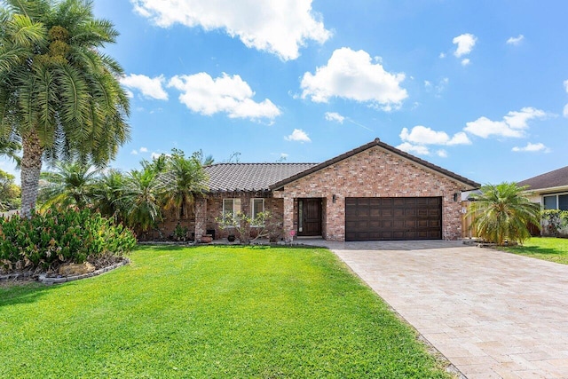 21786 Banyanwood Rd, Boca Raton, FL 33433 - single story home with a front lawn, decorative driveway, brick siding, and a garage