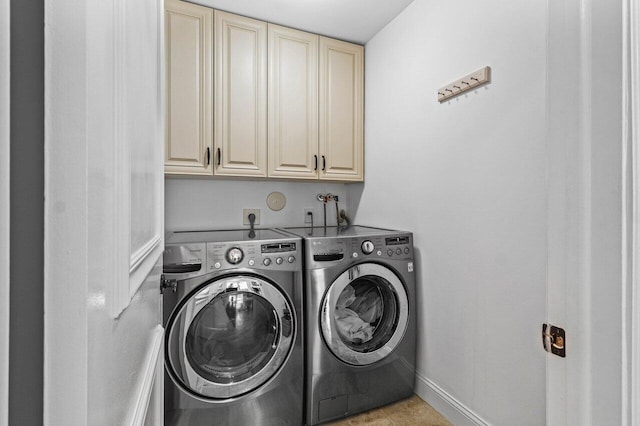 21786 Banyanwood Rd, Boca Raton, FL 33433 - laundry area with baseboards, cabinet space, and washer and clothes dryer