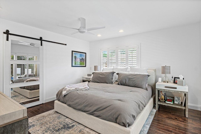 21786 Banyanwood Rd, Boca Raton, FL 33433 - bedroom with wood finished floors, a barn door, recessed lighting, and multiple windows
