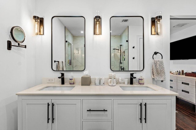 21786 Banyanwood Rd, Boca Raton, FL 33433 - full bathroom with wood finished floors, a marble finish shower, double vanity, and a sink