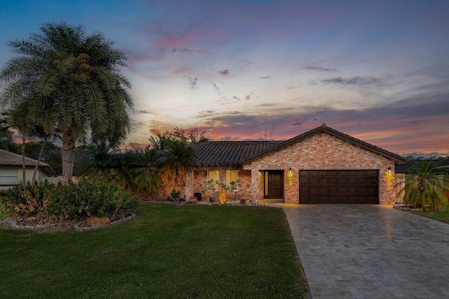 21786 Banyanwood Rd, Boca Raton, FL 33433 - single story home with a front yard, driveway, an attached garage, and a tiled roof