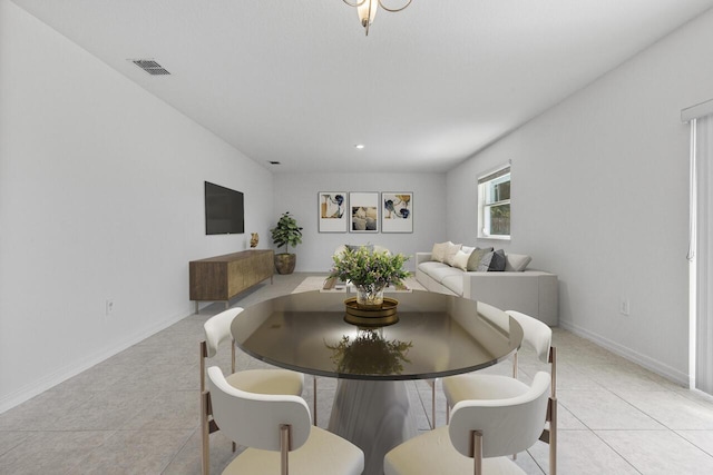 dining space with visible vents, baseboards, and light tile patterned flooring