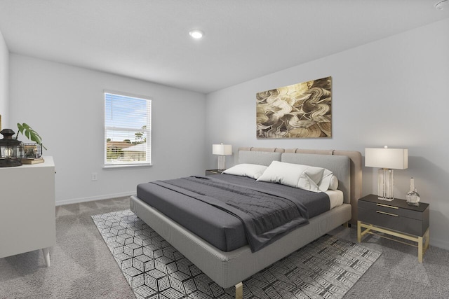 carpeted bedroom featuring baseboards