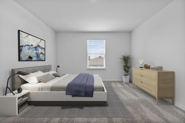 bedroom with baseboards and carpet floors