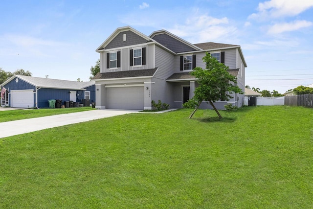 view of front of house featuring concrete driveway, an attached garage, a front yard, fence, and a shingled roof