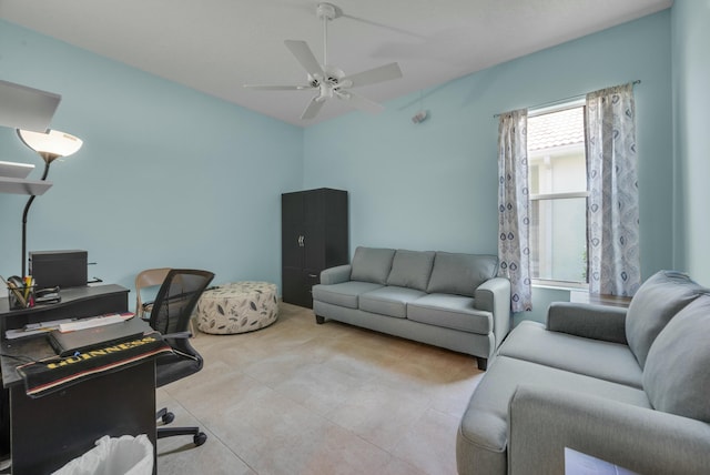 office featuring a ceiling fan, light tile patterned flooring, and visible vents