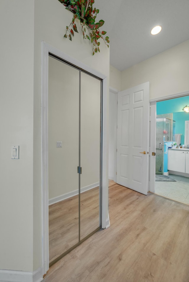 bathroom featuring a bath, a wealth of natural light, toilet, and vanity