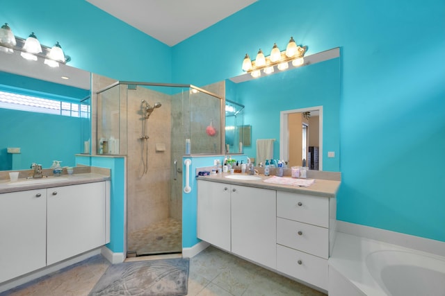 full bathroom with vanity and a stall shower