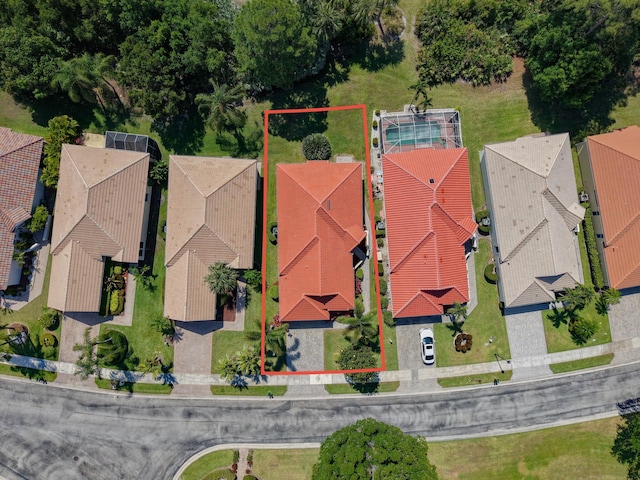 bird's eye view featuring a residential view and a water view