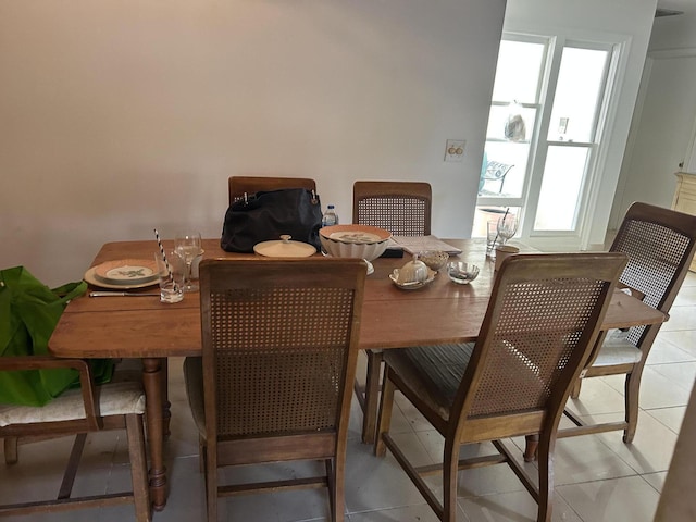 dining area featuring light tile patterned floors