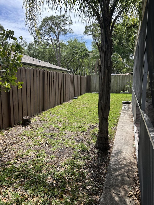 view of yard with a fenced backyard