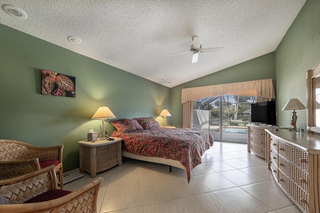 bedroom featuring a textured wall, access to exterior, vaulted ceiling, and light tile patterned floors