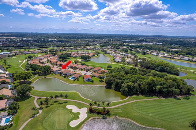 birds eye view of property featuring a water view, view of golf course, and a residential view