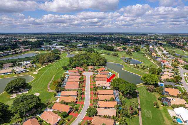 aerial view with a water view, golf course view, and a residential view