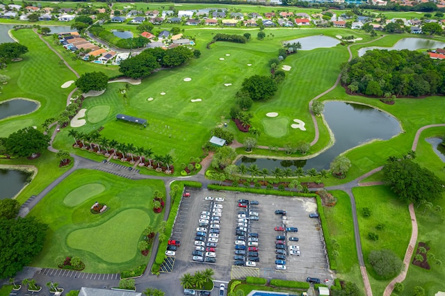 aerial view with a water view and golf course view