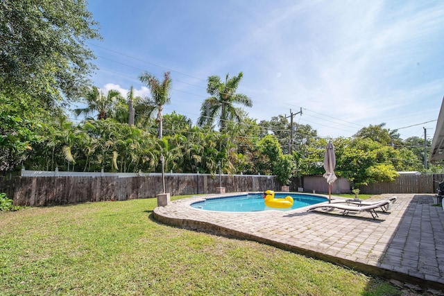 941 NW 26th Ct, Wilton Manors, FL 33311 - view of swimming pool with a fenced backyard, a fenced in pool, a patio area, and a lawn
