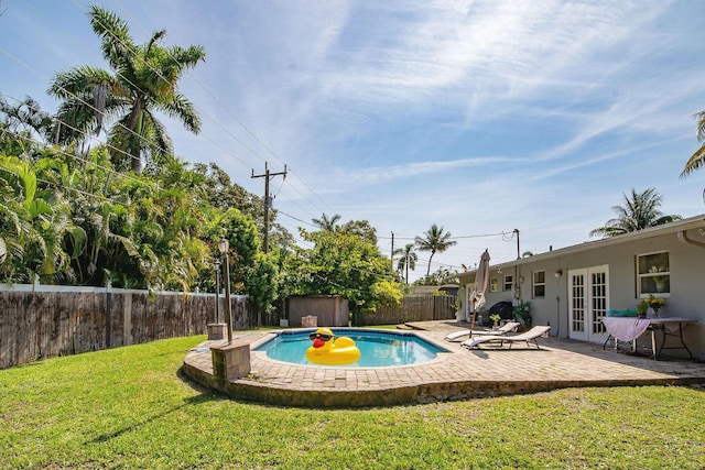 941 NW 26th Ct, Wilton Manors, FL 33311 - view of pool featuring a yard, a fenced backyard, a patio, french doors, and a fenced in pool