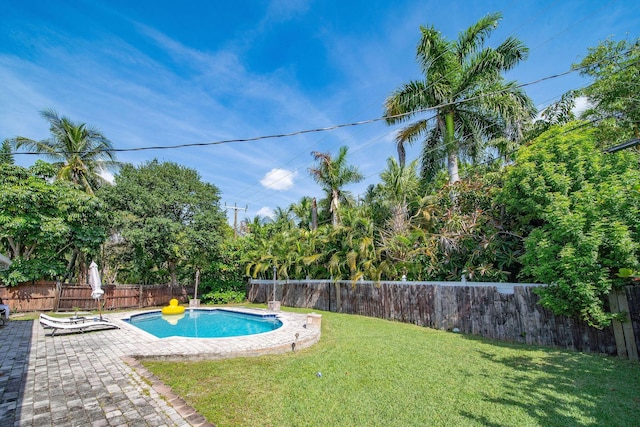 941 NW 26th Ct, Wilton Manors, FL 33311 - view of pool with a fenced backyard, a patio, and a lawn