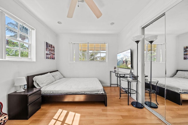 941 NW 26th Ct, Wilton Manors, FL 33311 - bedroom with ornamental molding, light wood finished floors, and a ceiling fan