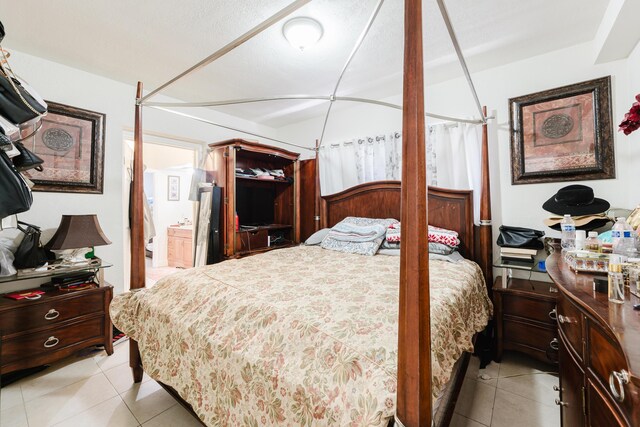 1285 NE 154th St, North Miami Beach, FL 33162 - bedroom featuring light tile patterned floors and ensuite bath