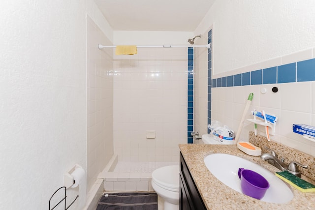 1285 NE 154th St, North Miami Beach, FL 33162 - bathroom featuring a tile shower, tile walls, toilet, and vanity