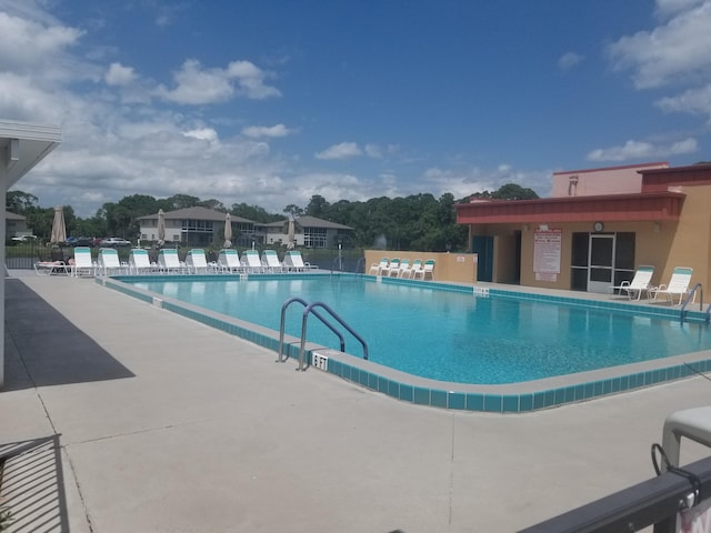 7 Lake Vista Trl Unit 204, Port Saint Lucie, FL 34952 - community pool featuring a patio area