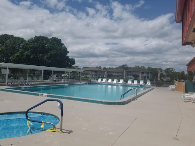 7 Lake Vista Trl Unit 204, Port Saint Lucie, FL 34952 - community pool featuring a patio area
