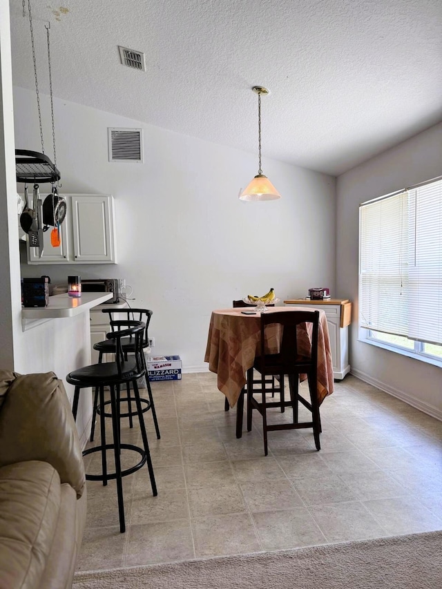 5155 NW N Macedo Blvd, Port Saint Lucie, FL 34983 - dining room with a textured ceiling and baseboards