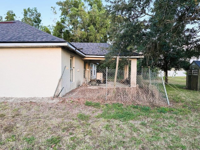 5155 NW N Macedo Blvd, Port Saint Lucie, FL 34983 - back of property with stucco siding and a shingled roof