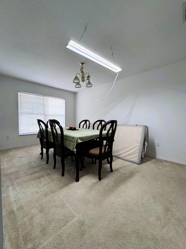 5155 NW N Macedo Blvd, Port Saint Lucie, FL 34983 - dining space with carpet, a chandelier, and a textured ceiling