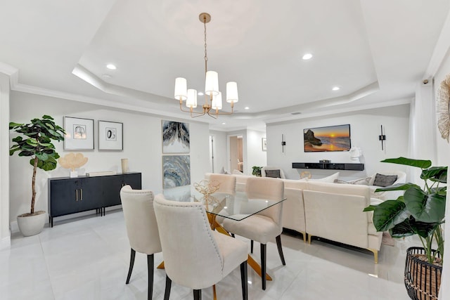 dining space featuring a tray ceiling, recessed lighting, and a notable chandelier