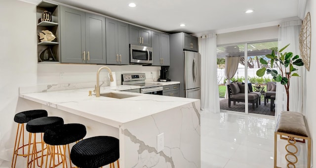 kitchen with open shelves, a sink, appliances with stainless steel finishes, recessed lighting, and light stone counters