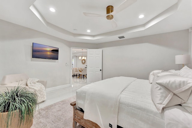 bedroom with a raised ceiling, baseboards, a ceiling fan, and recessed lighting