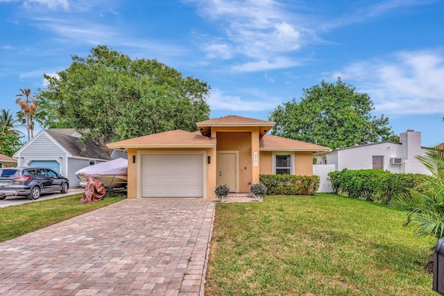 view of front of home with stucco siding, decorative driveway, an attached garage, a front yard, and fence