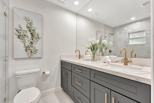full bathroom with a sink, visible vents, toilet, and a marble finish shower