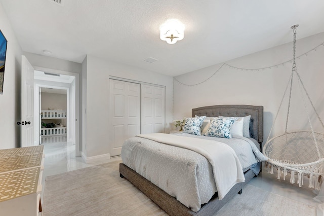 bedroom with a closet and visible vents