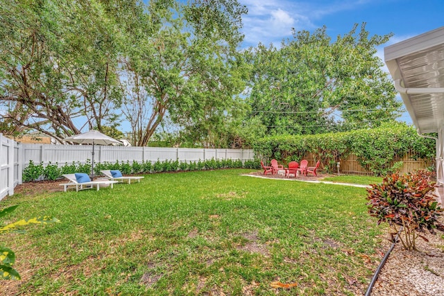 view of yard featuring a patio area and a fenced backyard