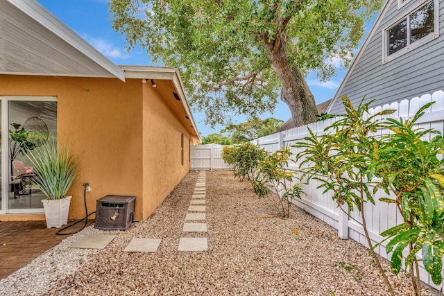 exterior space featuring a fenced backyard, stucco siding, and a patio area