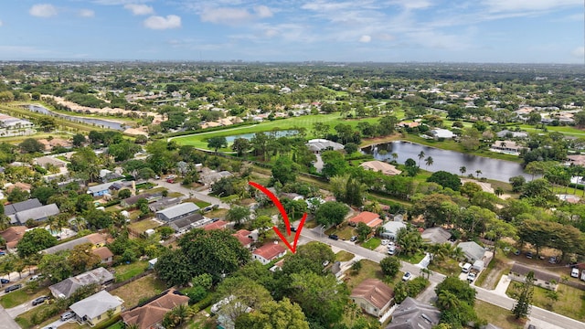 bird's eye view with a residential view and a water view