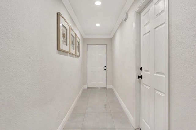 hall with ornamental molding, baseboards, recessed lighting, and light tile patterned flooring