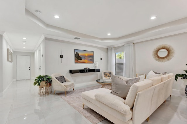 living area featuring a raised ceiling, visible vents, and recessed lighting