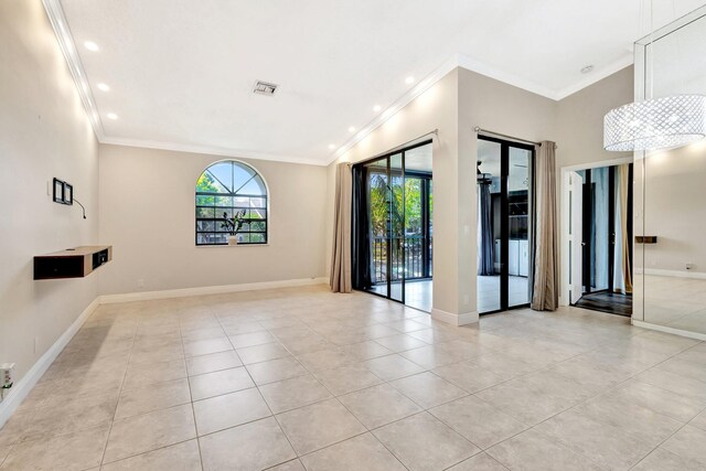 5439 Verona Dr Unit P, Boynton Beach, FL 33437 - unfurnished living room with light tile patterned floors, crown molding, recessed lighting, and baseboards