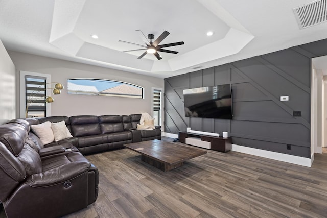 1784 SW Erie St, Port Saint Lucie, FL 34953 - living room featuring ceiling fan, a tray ceiling, visible vents, recessed lighting, and wood finished floors