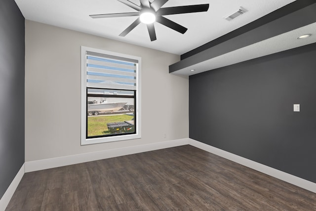 1784 SW Erie St, Port Saint Lucie, FL 34953 - unfurnished room featuring dark wood-style floors, baseboards, a ceiling fan, and visible vents