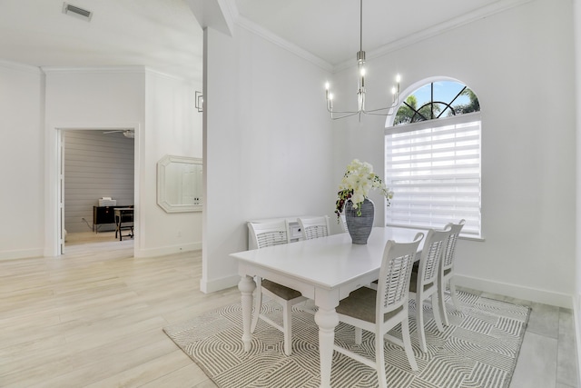 dining room featuring visible vents, baseboards, an inviting chandelier, crown molding, and light wood finished floors