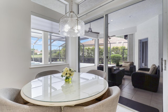 dining room with a chandelier and tile patterned floors